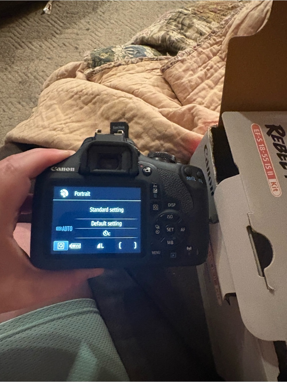 Canon DSLR Camera with Black Body and Blue LCD Menu Screen